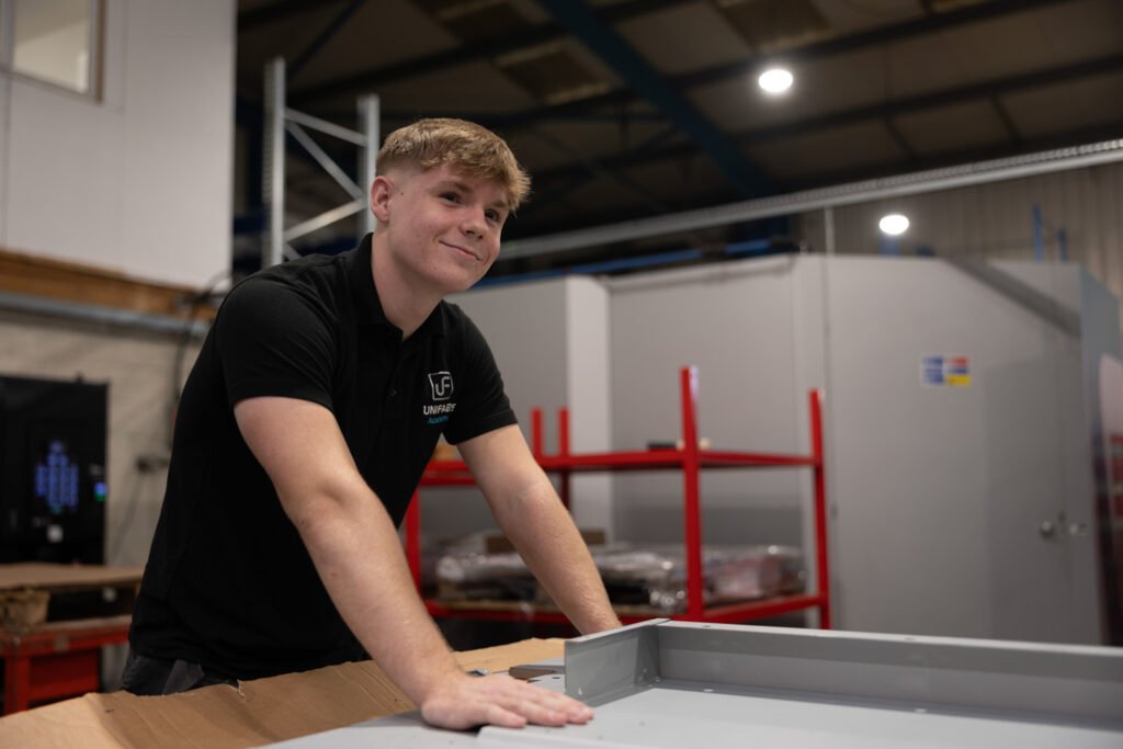 Unifabs Academy apprentice working on large folded sheet metal part