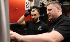 Apprentice supervisor trains apprentice on press brake set up