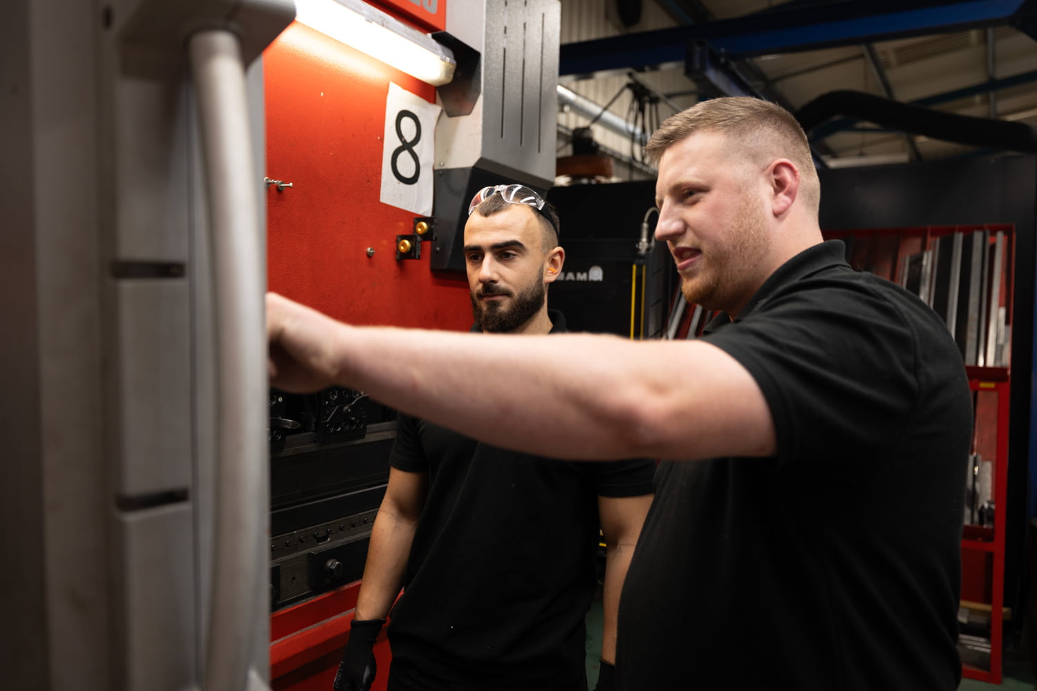 Unifabs Academy supervisor trains apprentice on press brake HMI