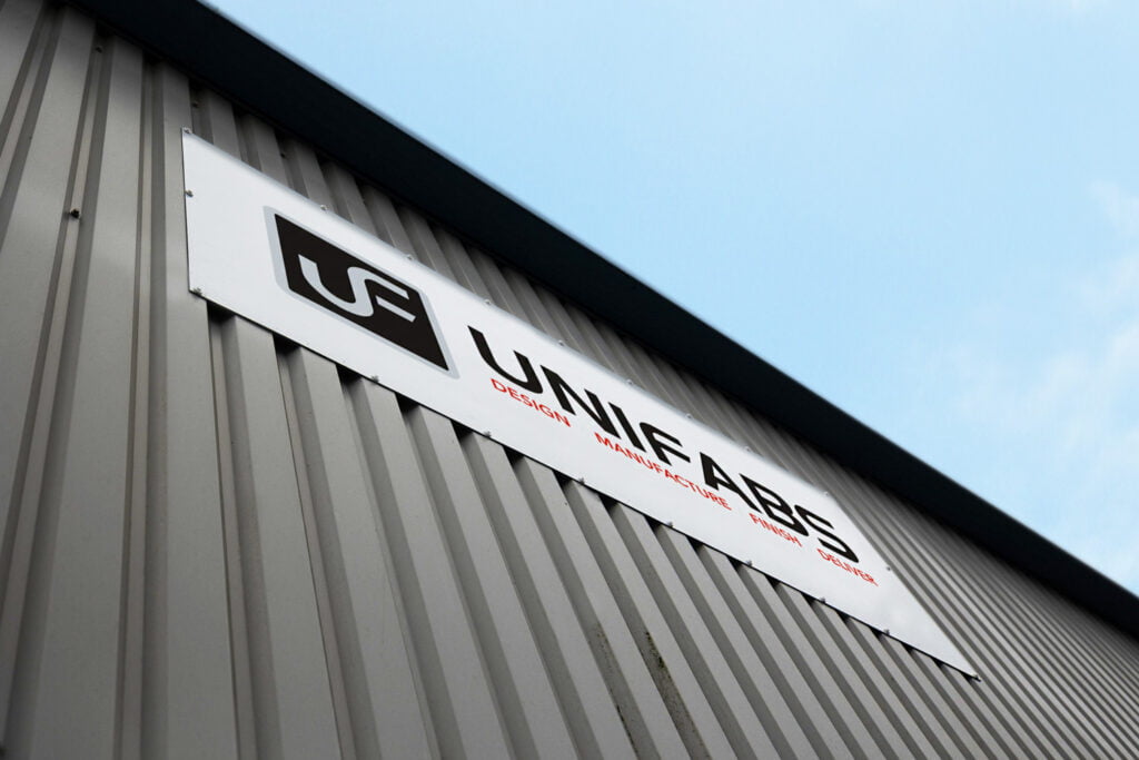 Sheet metal fabrication company  Unifabs' Building and signage against blue sky