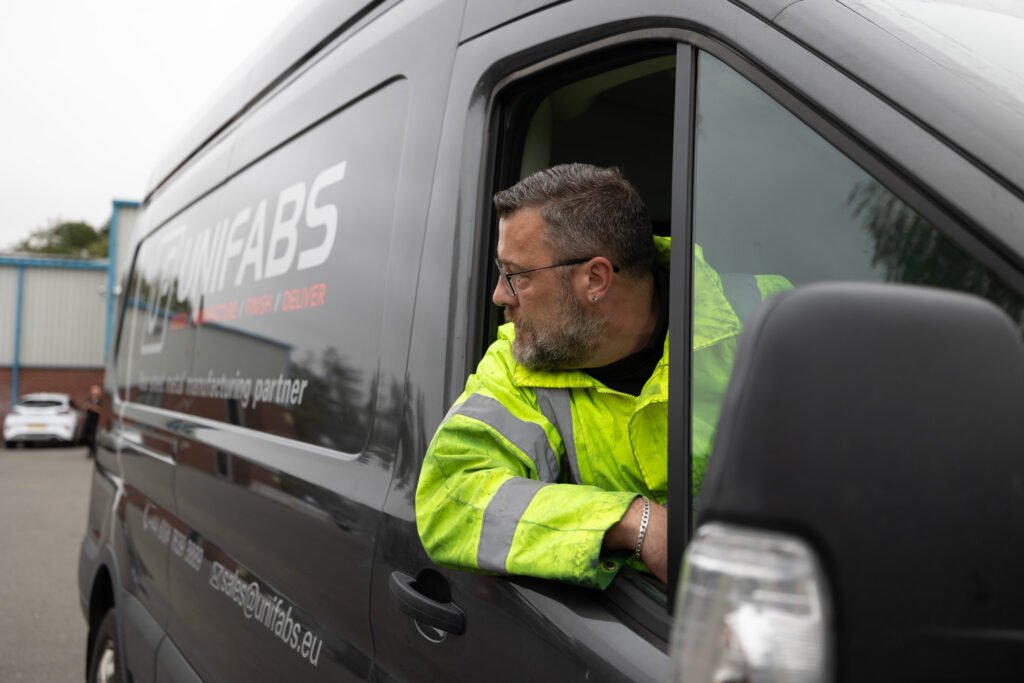 Unifabs van and delivery driver collecting goods