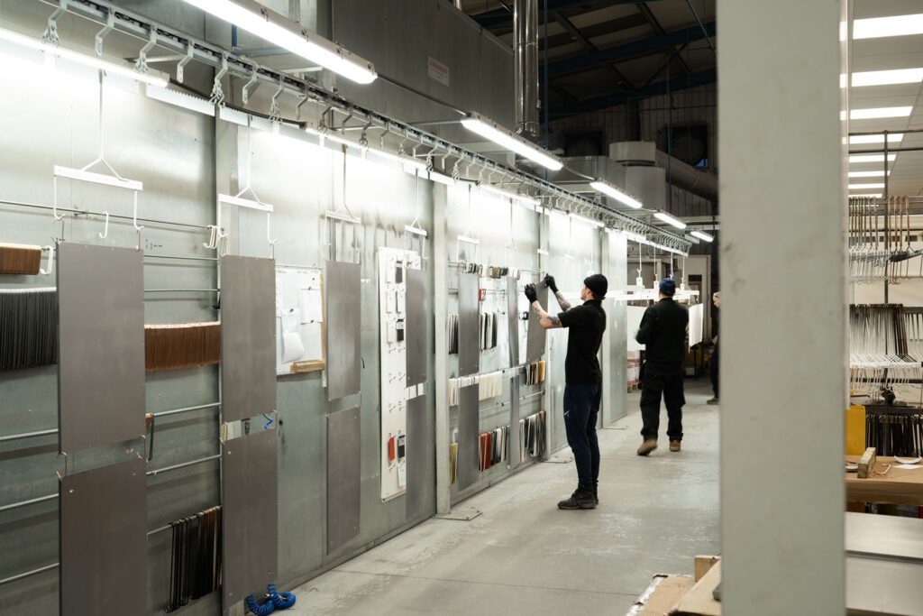 operator hanging parts for automated powder coating line