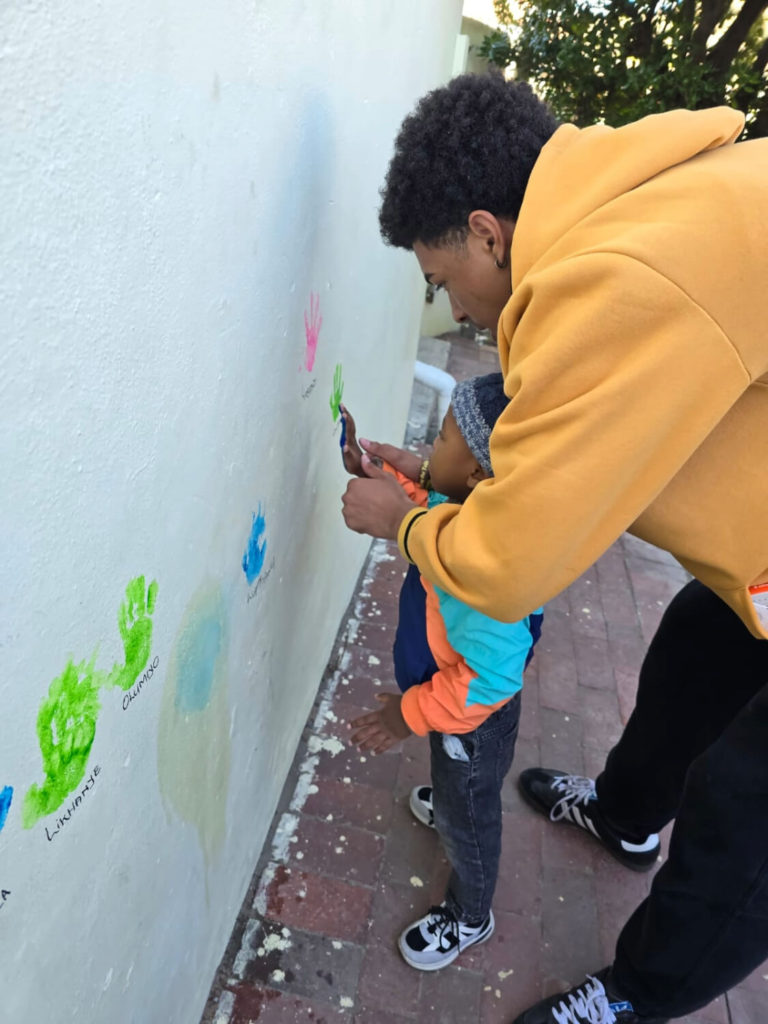 Siyakhula Preschool handprints on building wall