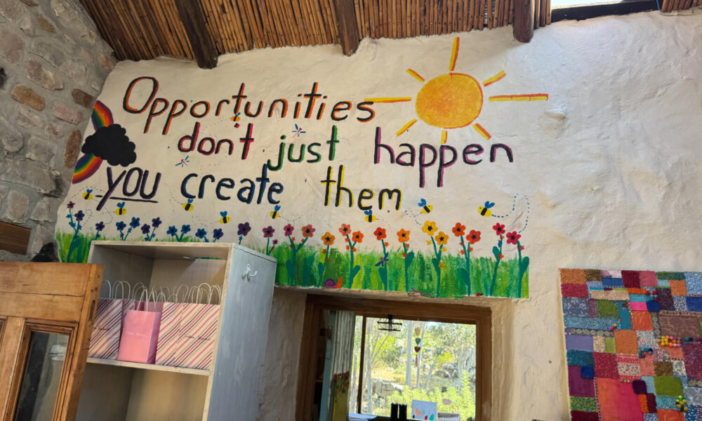 "Opportunities don't just happen you create them" wall mural at the GLO House South Africa during a CSR partnership visit by Unifabs