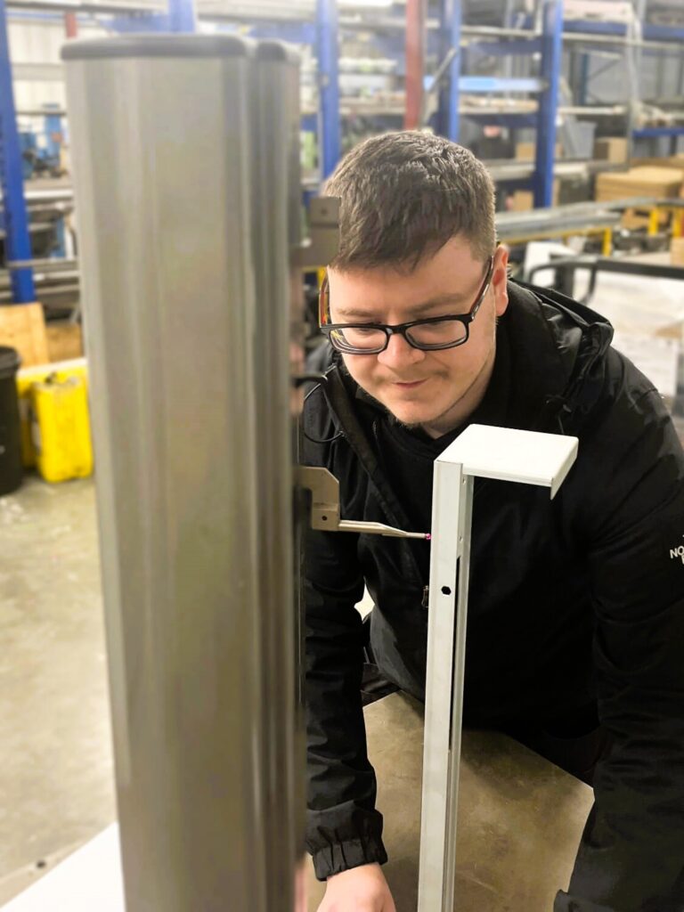 Engineering Manufacturing Technician Apprentice Owen quality checking part