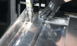 Laser welding services at Unifabs operator with handheld laser welding gun welds aluminium fabrication