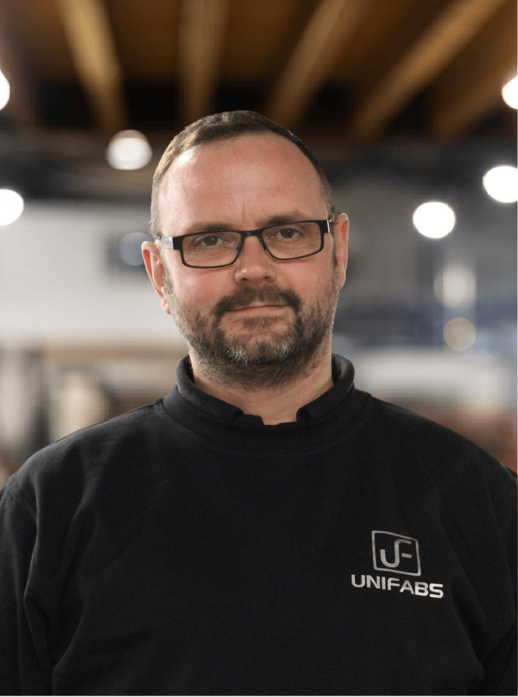 Chris Lawrence Production Manager Unifabs Ltd standing in the forming building